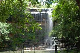 Mallela Theertham Waterfalls flowing from rocky cliffs surrounded by dense green forest in the Nallamala Hills